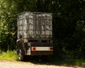 Livestock Water Tank on small trailer next to a hedgerow