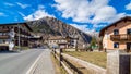 Livigno village, street view with old wooden houses, Italy, Alps Royalty Free Stock Photo