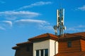 Living building with GSM antennas on roof