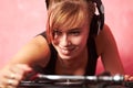 Living the dream. Closeup of a young female dj putting a record on the turntable. Royalty Free Stock Photo