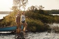 Living the lakeside dream. Portrait of a young couple going for a canoe ride on the lake. Royalty Free Stock Photo