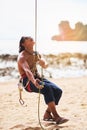 Living life on the extreme side. a young man climbing a mountain on a sunny day. Royalty Free Stock Photo