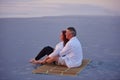 Living life in the slow lane. a mature couple relaxing together on the beach. Royalty Free Stock Photo