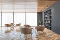 Living room with beige furniture and wooden floor, reading room with window Royalty Free Stock Photo