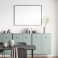 Living room with black framed poster above green sideboard and table