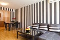 Living room with black and white striped walls Royalty Free Stock Photo