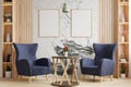 Living room with blue armchairs sits on the wooden floor, decorated with vases on the shelves, and has a picture frame on the Royalty Free Stock Photo