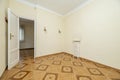 Living room with brown stoneware floors with geometric figures, solid wood doors, golden sconces on the wall and cast iron Royalty Free Stock Photo