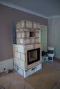 In a living room is built a tiled stove Royalty Free Stock Photo