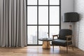 Living room with chair, table and city view