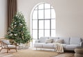 Living Room Christmas interior in Scandinavian style. Christmas tree with gift boxes. white sofa on wall Mockup. Royalty Free Stock Photo