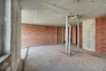 Living room with concrete and brick walls, concrete ceiling, floor