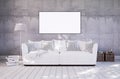 Living room with couch and empty frame on wall Royalty Free Stock Photo