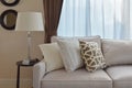 Living room design with sturdy tweed sofa with brown pillows