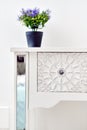 Living room detail design stylish luxury furniture floral ornate carving art of bedside table violet natural flower potted plant o Royalty Free Stock Photo