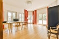 a living room and dining room with wood flooring