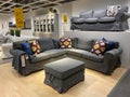 A living room display with a couch and decoration at an IKEA store in Orlando, Florida