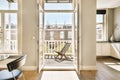 a living room with a door open to a balcony Royalty Free Stock Photo