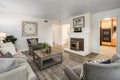 A living room filled with furniture and a fire place