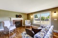 Living room with fireplace and antique chairs