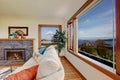 Living room with fireplace and beautiful window view Royalty Free Stock Photo