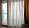 Living room with glass door to balcony. Sea view