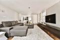 a living room with a gray couch and a tv