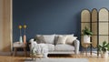 Living room with gray sofa and dark blue wall Royalty Free Stock Photo