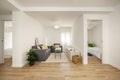 living room with gray sofa, low tables, white sideboard