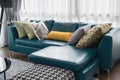 Living room with green sofa and pillows
