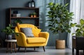 living room and home office with yellow chair, blue couch and grey tree Royalty Free Stock Photo