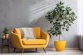 living room and home office with yellow chair, blue couch and grey tree Royalty Free Stock Photo