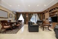 Newly decorated modern living room with a circular marble coffee table, varnished French oak parquet floors, white shag carpet and