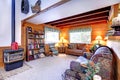 Living room interior with antique fireplace in log cabin house Royalty Free Stock Photo