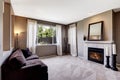 Living room interior with carpet floor and dark sofa