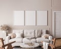 Living room interior with frame mock up, natural wooden furniture and trendy home accessories on bright beige background Royalty Free Stock Photo