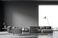 Living room interior with large grey sofa, two comfortable armchairs Royalty Free Stock Photo