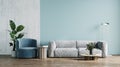 Living room interior mockup with gray sofa, armchair, plant and coffee table on green wall background, 3d rendering Royalty Free Stock Photo