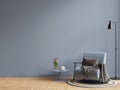 Living room interior room wall mockup in dark tones and blue armchair with coffee table Royalty Free Stock Photo