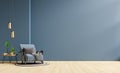 Living room interior room wall mockup in dark tones and blue armchair with coffee table Royalty Free Stock Photo