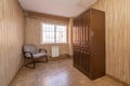 Living room with kitschy wallcovering and paneled