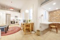 Living room of a loft-style house with an open kitchen and a bedroom in the upper part furnished and decorated with Moroccan-style Royalty Free Stock Photo