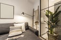 Living room of a loft-style rental house with a sofa with a chaise longue in gray fabric with white cushions, a mirror screen and