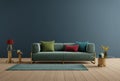 Living room in modern style with green sofa colourfull pillow wooden floor and blue wall background Royalty Free Stock Photo