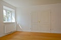 Living room in an old building - Apartment with double door and parquet flooring after renovation