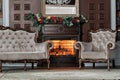 Living room. Old studying room with fabric armchairs. Classic bookcase filled with books. Fireplace Royalty Free Stock Photo