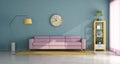 Living room with pink sofa and vintage furniture elements