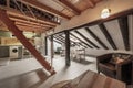 living room of a studio apartment with wooden beams and columns