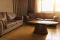 Living room or Waiting room leather sofa with wooden table  vintage style decoration brown color tone Royalty Free Stock Photo