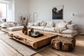 Living room with white sofa and heavy wooden table on white fluffy carpet